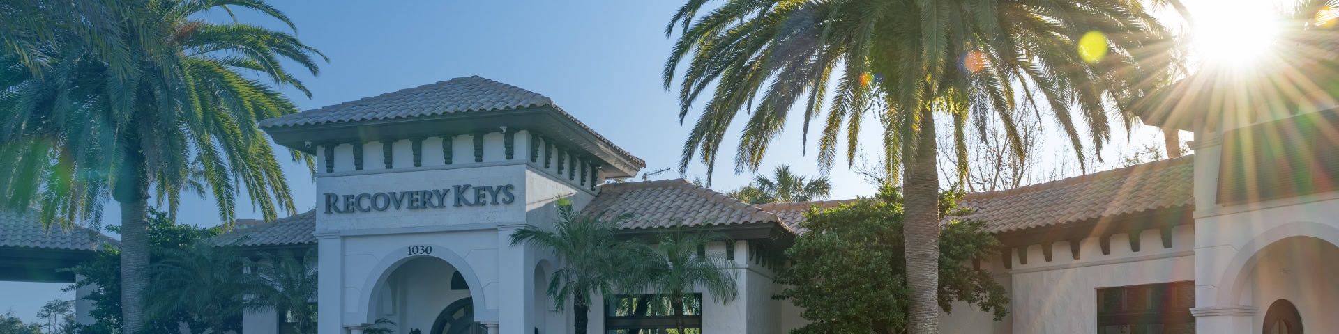 Recovery Keys addiction treatment center in Ponte Vedra Beach, Florida, framed by palm trees