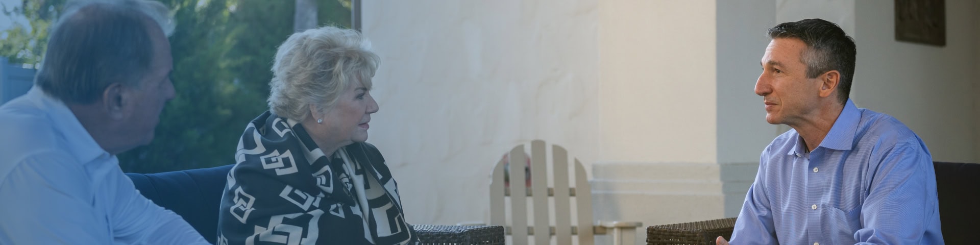 A Recovery Keys primary therapist leading a small group therapy session outdoors